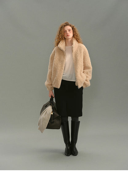 Model wearing cream beige 100% wool high-neck jacket with skirt and knee boots, full front view