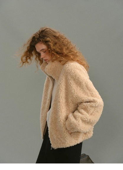Side view of cream beige wool high-neck jacket with model&