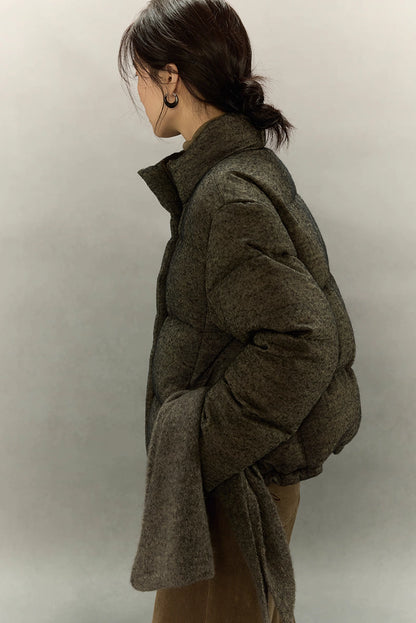 Side view of wool-blend down jacket showing sleeve volume and texture.