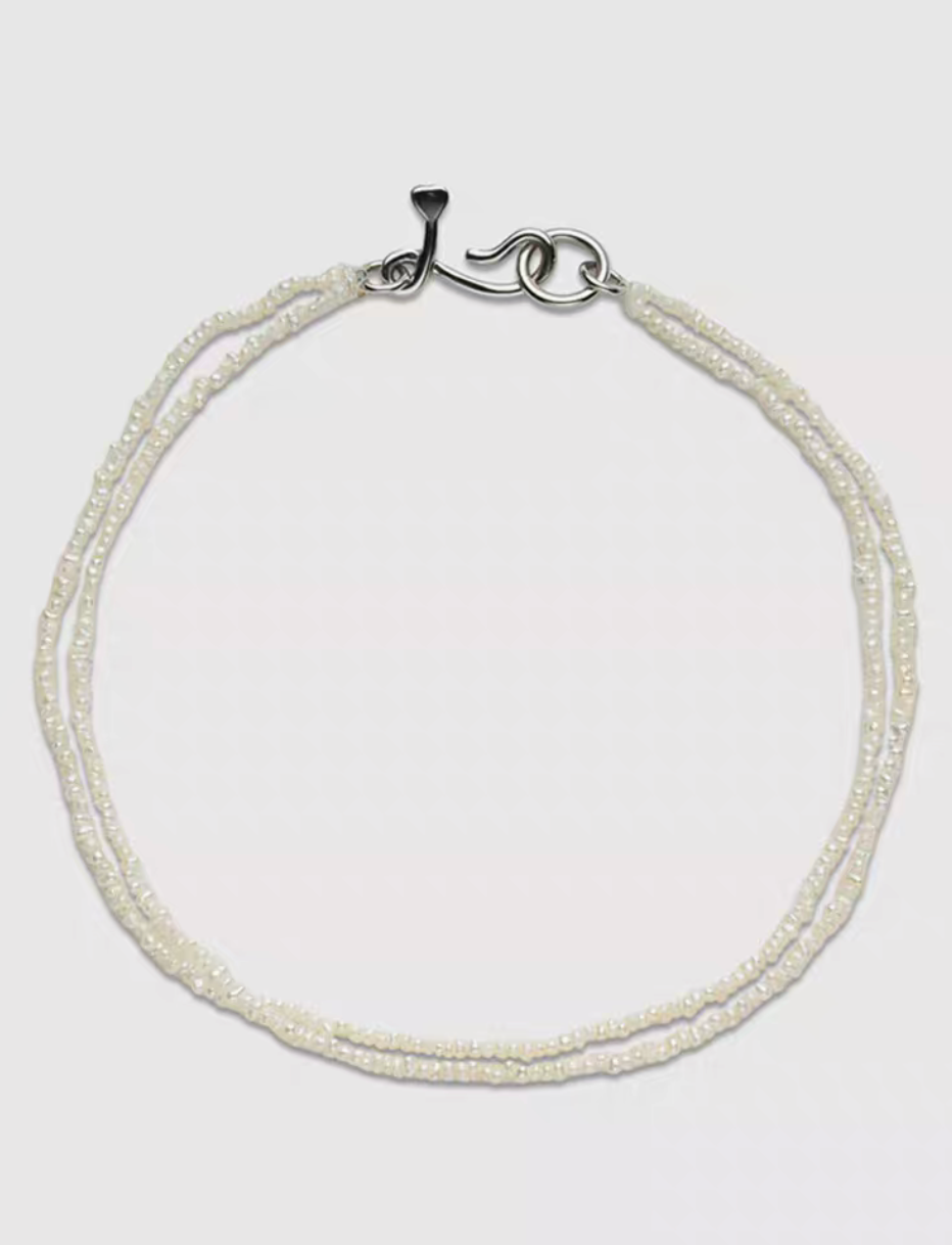 Wrapped Micro Pearl Bracelet with Hand-Formed Silver Clasp natural color full bracelet flat lay on white background