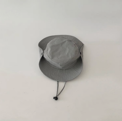 Youth outdoor quick dry sun hat in light gray color front view with adjustable chin strap