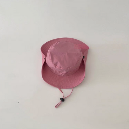 Youth outdoor quick dry sun hat in pink color front view with adjustable chin strap